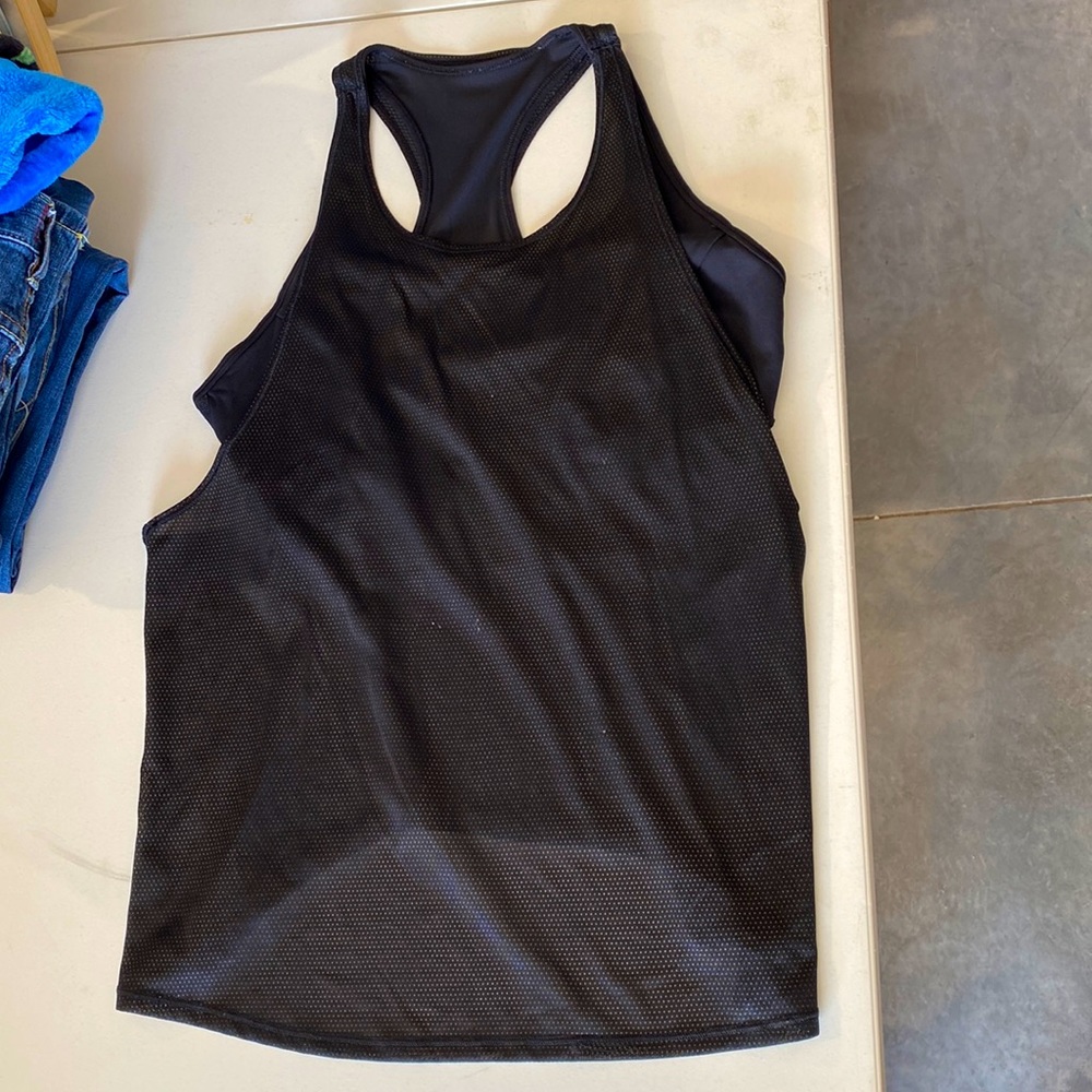 Lululemon workout tank. Black with gold In the mesh. Size 6, I think.